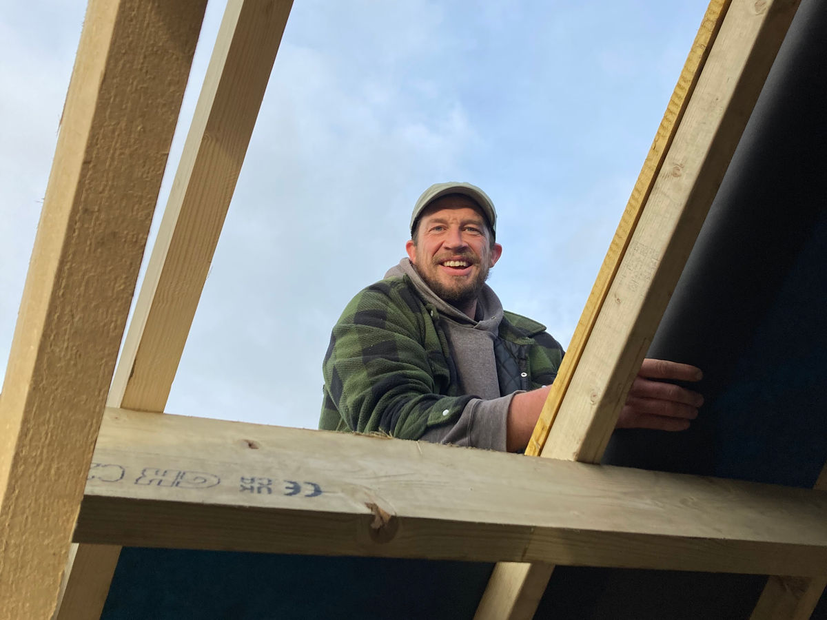 Calum Powys Wilkinson working on a roof