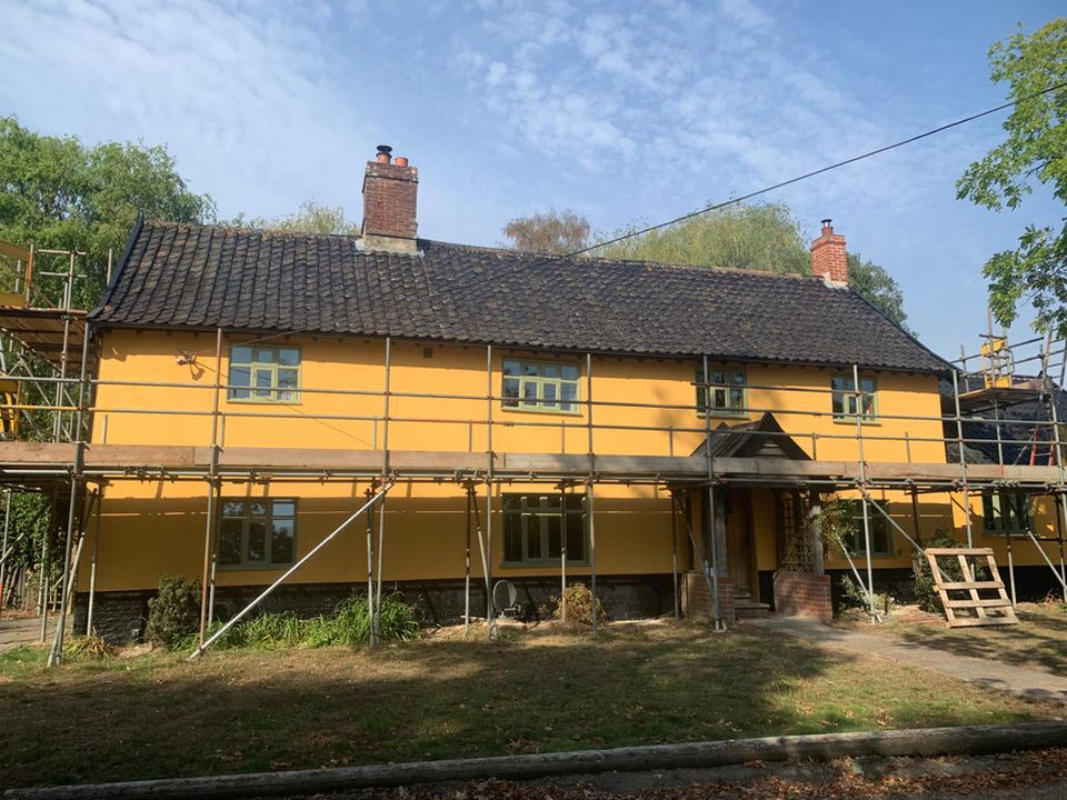 Timber-framed home undergoing renovation of its front elevation