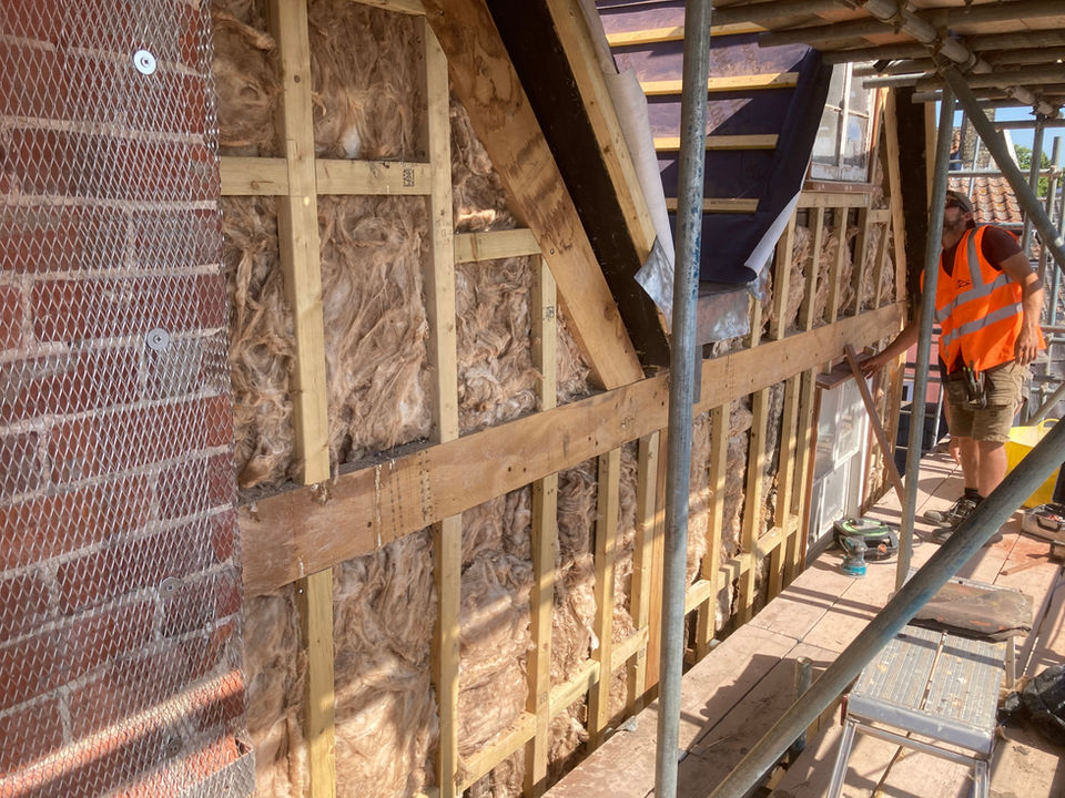 Lime plaster render on traditional larch laths